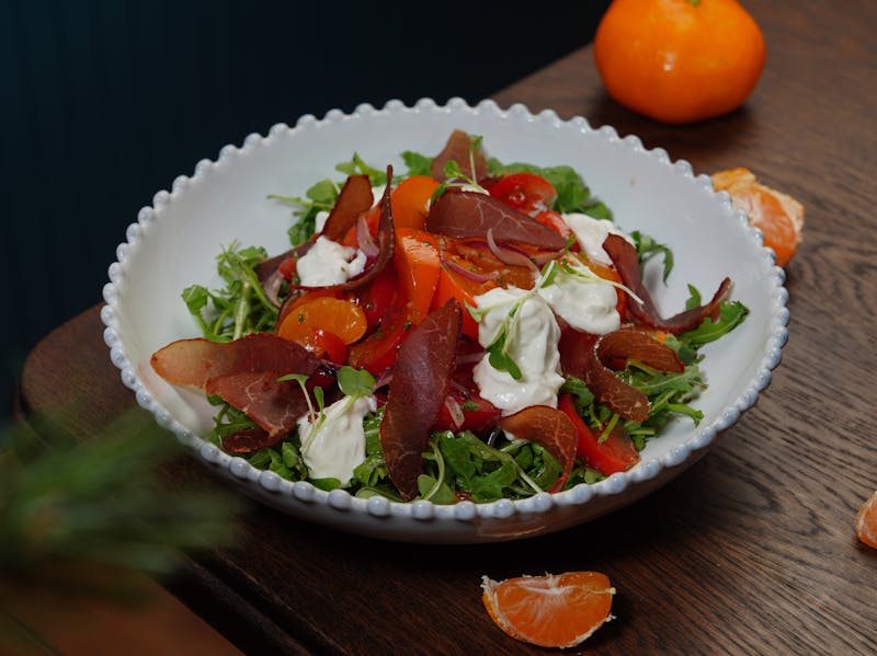 Arugula and prosciutto salad with shaved parmesan